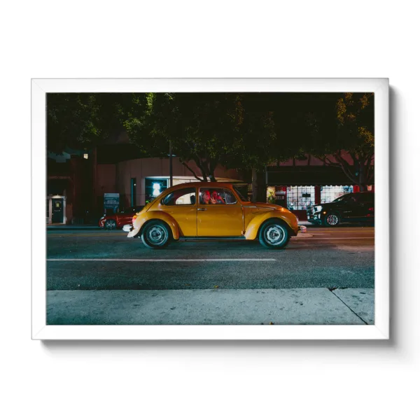 Image of an orange VW Beetle with a woman waving out with the hand gesture "Peace".