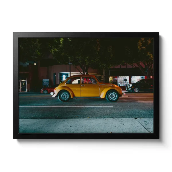 Image of an orange VW Beetle with a woman waving out with the hand gesture "Peace".
