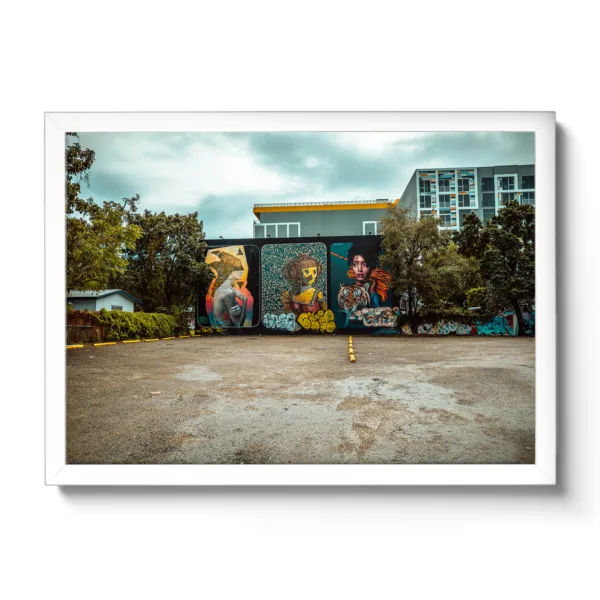 Image of an empty parking lot that has been sprayed with graffiti.