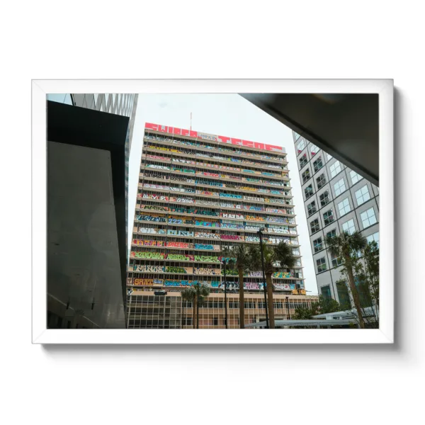 Picture of a building covered in graffiti.