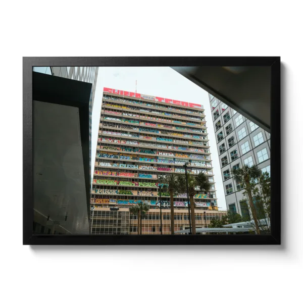 Picture of a building covered in graffiti.
