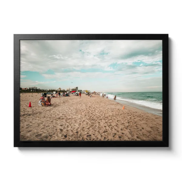 Beach shot of Miami Beach. People chilling on the beach and blue sea