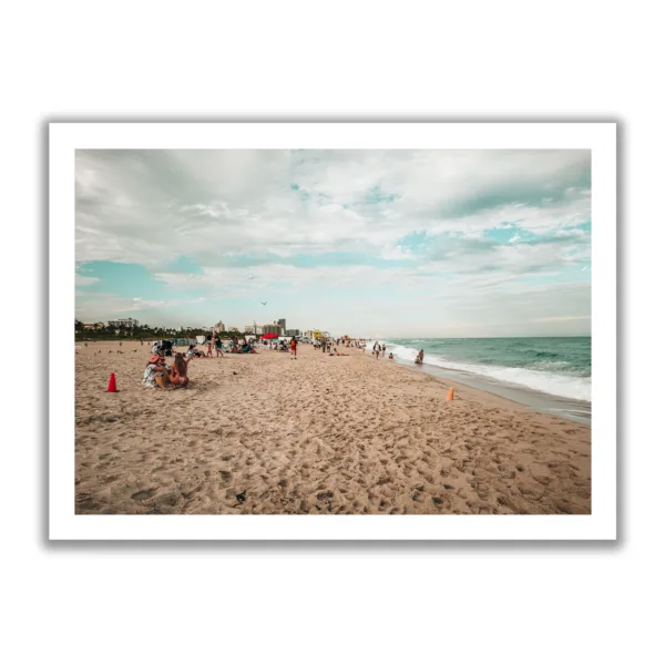 Beach shot of Miami Beach. People chilling on the beach and blue sea