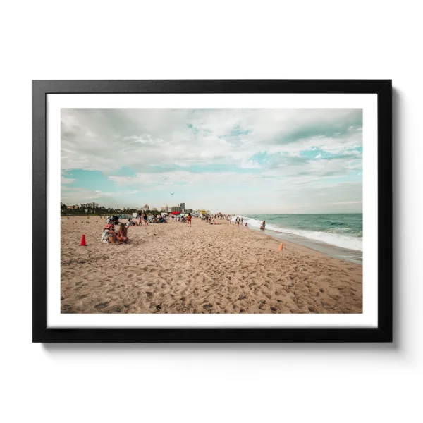 Beach shot of Miami Beach. People chilling on the beach and blue sea